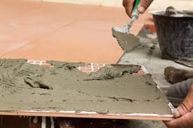 how thick should tile adhesive be