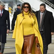 Melania trump stands out from the crowd in a chic white suit as she watches her husband present the medal of freedom to yankees legend mariano rivera. Melania Trump Wearing Yellow Ralph Lauren Coat Popsugar Fashion