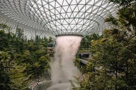 Jewel changi is home to what's now the world's tallest indoor waterfall — called the hsbc rain vortex, and is surrounded by tens of thousands of trees, plants, and shrubs. Jewel Changi Airport Houses The World S Tallest Indoor Waterfall