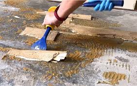 remove adhesive from concrete floors