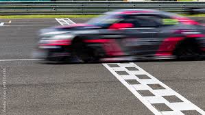 race car blurred motion crossing the