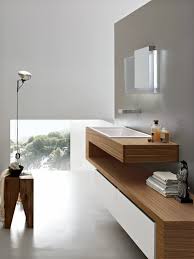 The light wood furniture and white fixtures bring a needed touch of light, color, and organic feel. Ultra Modern Bathroom Designs Update The Decor Of Your Bathroom With These Ideas