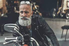 Tired Glance Of Old Man On Bike Stock Photo - Download Image Now - Biker, Motorcycle, Senior Adult - iStock