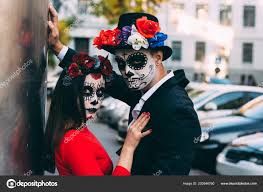 couple wearing skull make all souls day