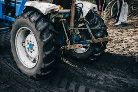 blue and black tractor free stock photo