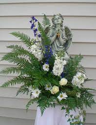 Sympathy flowers with angel keepsake. Pin By Banner Flower House On Funeral Flowers Flower Arrangement Supplies Funeral Flower Arrangements Memorial Flowers