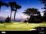 golf course and golfers in san francisco california with view of ...