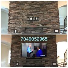 stone and brick fireplace tv mounting
