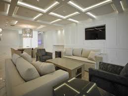 Ceiling fans often come with light kits, and it's common for folks to want to control the fan and light(s) independently. White Modern Media Room With Coffered Ceiling Hgtv