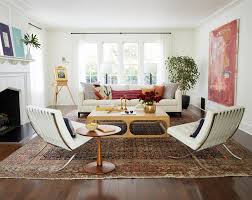 You can create this look either with two sofas and a coffee table inbetween or slighly off balanced it with a sofa facing two armchairs. 20 Living Room Furniture Arrangement Ideas For Any Size Space Better Homes Gardens