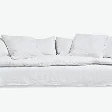white slipcovered sofas are back in