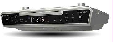 Easily mount this under your kitchen counter cabinet and play all your favorite music wirelessly from your bluetooth enabled device. Amazon Com Sylvania Skcr2713 Under Counter Cd Player With Clock Radio And Bluetooth Silver Home Audio Theater