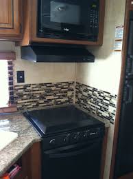 Shop our selection of tile backsplashes in the flooring department at the home depot. Replaced The Hideous Wallpaper Border With Peel And Stick Smart Tiles From Home Depot Love The Kitchen Backsplash Designs Remodeled Campers Camper Decor