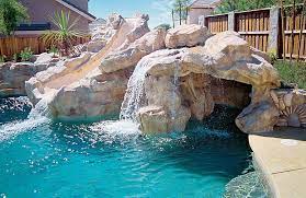 At the time i spoke with her, they were about a week from completing the pool. Swimming Pool Rock Waterfall Pictures Blue Haven Pool Waterfall Pool Water Features Affordable Swimming Pools