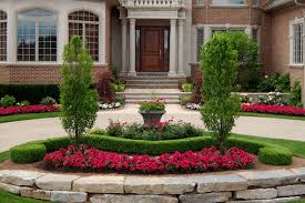 In this front yard landscape they used a stone pathway, and surrounded it with a mass planting of mondo grass. 6 Tips For Front Yard Landscape Design In Ottawa Jonathan Roberts Landscapes