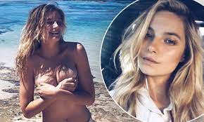Victoria's Secret model Bridget Malcolm goes TOPLESS as she flaunts her  sensational curves at beach | Daily Mail Online
