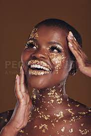 gold glitter flake and black woman