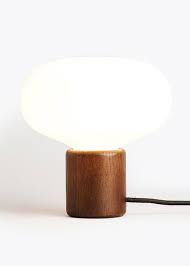 The table lamp by new works has exclusive, natural materials which blends harmoniously into the setting. Karl Johan Table Lamp New Works