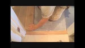 flat hardwood floor transition to tile