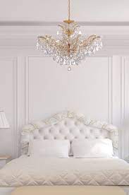 Here are the sizing formulas for two common bedroom chandelier placements so you can know if you need a small bedroom chandelier or a larger option: Maria Theresa Gold Crystal Chandelier In White Bedroom Traditional Bedroom New York By Lighting Outlet Ny Houzz