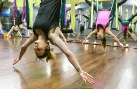 7 aerial yoga benefits for soaring