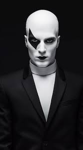 white face and black makeup on his face