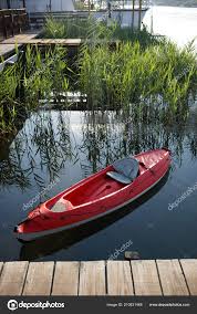 kayak floating water tied wooden dock