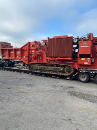 a lowboy and rgn trailer