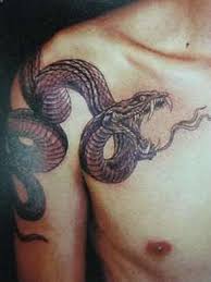 This one in particular has unusual patterns that are more appealing to the eye than they bare meaning. Perseus Has A Snake Like Tattoo On His Left Arm That Stretches To His Chest That Moves On It S Own It Slithers Arou Snake Tattoo Design Tattoos Trendy Tattoos