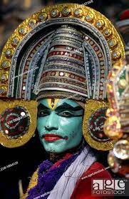 kathakali dancer in costume with green