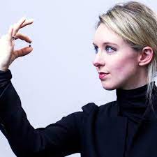 The Big Blue Eyes & The Sexy Black Box: How Elizabeth Holmes Exposed  America | by David Saint Vincent | An Injustice!