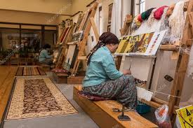 turkish woman making wool a carpet