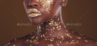 gold makeup on brown background