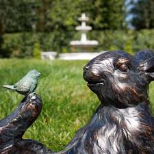 Bird Sitting On Rabbit Garden Sculpture