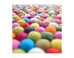 bright multicolor felt ball rug for