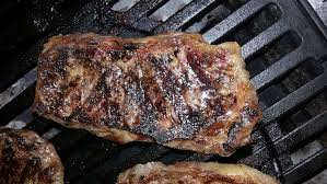 On the hot side of the grill during the last 15 minutes of cooking time for the onions place your steaks on the grill. How To Grill A Ny Strip Steak 4thegrill Com