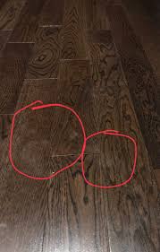 dark hardwood floor footprints