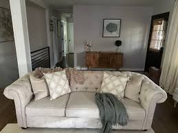 beige linen tufted sofa in
