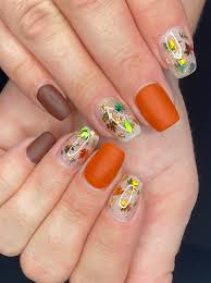 autumn leaves and glitter nail design