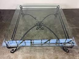 A Large Glass Top Wrought Iron Coffee Table