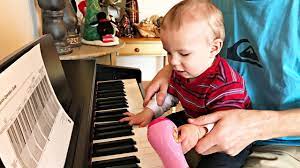 baby plays piano baby adam play