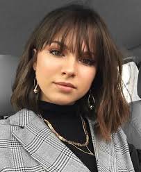 The short bangs combine with layers and hair products to help thicken locks up, giving it this gorgeous curly texture. Pin On Special Cute Medium Length Hairstyles Medium Length Hair Styles Medium Hair Styles