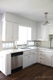White cabinets with white appliances are the ultimate combo for a clean, seamless look. Update Appliances With Stainless Steel Contact Paper Julie Blanner