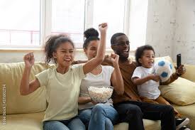 score a goal excited african family
