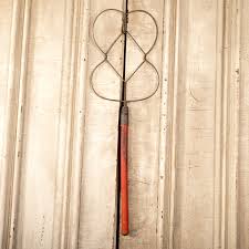 antique primitive wood metal rug beater