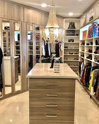 You know you've made it big when you have a closet with its very own island. How To Turn A Spare Room Into Your Dream Closet Dressing Room