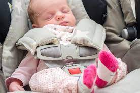 Newborn Baby Girl In A Car Seat Stock