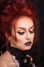 y woman with gothic makeup and red