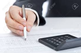 Business Finance Man Calculating Budget Numbers With Calculator