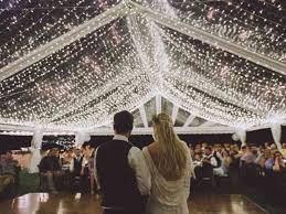 Newlyweds kissing at wedding reception. How To Plan An Amazing Wedding Reception